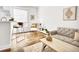 Bright living room featuring hardwood floors, modern furnishings, and ample natural light at 1629 N Clarkson St # 23, Denver, CO 80218