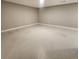 Unfurnished basement area with painted concrete floor and neutral walls at 9017 E Oxford Dr, Denver, CO 80237