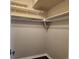 Walk-in closet with built-in shelves and plenty of hanging space, perfect for organization at 9017 E Oxford Dr, Denver, CO 80237