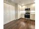 Updated kitchen with stainless steel appliances and wood-look floors, pantry, and more at 9017 E Oxford Dr, Denver, CO 80237