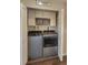 Convenient laundry area with modern washer and dryer and built-in storage cabinets at 9017 E Oxford Dr, Denver, CO 80237