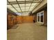 Enclosed back patio with a translucent roof and wooden gate at 9017 E Oxford Dr, Denver, CO 80237