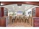 Finished basement with custom bar area, media setup, and ample seating for entertaining and leisure activities at 1287 Buffalo Ridge Rd, Castle Pines, CO 80108