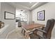 Functional office space with desk, chairs, and artwork providing a comfortable and productive work environment at 1287 Buffalo Ridge Rd, Castle Pines, CO 80108