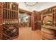 Spacious wine cellar featuring brick flooring, custom racks, and ample storage for wine enthusiasts at 1287 Buffalo Ridge Rd, Castle Pines, CO 80108