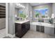This bathroom features a large soaking tub, dual vanity, and modern finishes at 3439 Uinta St, Denver, CO 80238