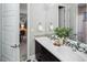 This bathroom has a dual vanity with modern fixtures and decor at 3439 Uinta St, Denver, CO 80238
