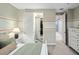 This bedroom has neutral decor with a view to other rooms at 3439 Uinta St, Denver, CO 80238