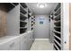 Spacious walk-in closet with custom shelving and storage solutions at 3439 Uinta St, Denver, CO 80238