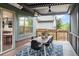Well-appointed covered patio offers outdoor dining and relaxation space with a view of the backyard at 3439 Uinta St, Denver, CO 80238