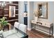 Stylish dining area with modern table, chairs, wood accent wall, and decorative mirror at 3439 Uinta St, Denver, CO 80238