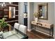 Contemporary dining room featuring a glass table, stylish decor, and rich wood accents, offering an elegant dining experience at 3439 Uinta St, Denver, CO 80238