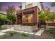 Brick home featuring manicured landscaping, modern architectural elements and welcoming front entrance at 3439 Uinta St, Denver, CO 80238