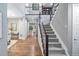 Spacious foyer with hardwood floors, staircase, and second-story overlook to above at 3439 Uinta St, Denver, CO 80238