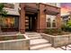Modern brick home with elegant landscaping and sleek front door entrance with visible house number at 3439 Uinta St, Denver, CO 80238