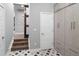 Hallway features unique tile flooring, closet and stairs with modern storage solutions, offering both functionality and style at 3439 Uinta St, Denver, CO 80238