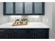 Chic kitchen area with blue cabinets, white countertops, and modern backsplash tiles at 3439 Uinta St, Denver, CO 80238