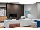 Cozy living room with a fireplace, comfortable seating, and modern decor at 3439 Uinta St, Denver, CO 80238