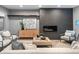 Elegant living room featuring a fireplace, modern furniture, and stylish decorative accents at 3439 Uinta St, Denver, CO 80238