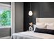 This main bedroom features a modern pendant light and luxurious neutral decor at 3439 Uinta St, Denver, CO 80238