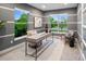 Bright office with large windows, modern desk, and neutral decor for a professional workspace at 3439 Uinta St, Denver, CO 80238