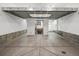 Large unfinished basement, offering potential for customization and expansion with a utility sink and window at 3439 Uinta St, Denver, CO 80238