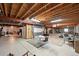 Large unfinished basement with exposed ceiling beams and concrete flooring at 3144 Stevens N Cir, Erie, CO 80516