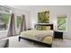 Bright bedroom with two large windows and a comfortable bed at 3144 Stevens N Cir, Erie, CO 80516