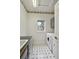 Functional laundry room with sink, cabinets, and laundry machines at 3144 Stevens N Cir, Erie, CO 80516