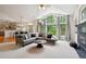 Sun-filled living room with vaulted ceilings, large windows, and an open concept design for modern living at 3144 Stevens N Cir, Erie, CO 80516