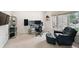 Well-lit office space featuring modern desk setup and a comfortable accent chair at 3144 Stevens N Cir, Erie, CO 80516