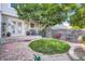 Backyard with patio and a small grassy area, surrounded by rock mulch and wood fencing at 19725 Rosewood Ct, Parker, CO 80138