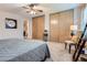 Comfortable bedroom features plush carpet, a ceiling fan, and generous closet space at 19725 Rosewood Ct, Parker, CO 80138