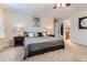 Inviting bedroom with plush carpet, large windows, and well-appointed decor at 19725 Rosewood Ct, Parker, CO 80138