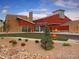 Attractive commercial building featuring modern architecture with a well-maintained green lawn at 19725 Rosewood Ct, Parker, CO 80138