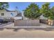 Home with a fenced yard and mature trees, offering privacy and curb appeal at 19725 Rosewood Ct, Parker, CO 80138