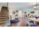 Spacious living room with staircase, hardwood floors, and modern decor at 19725 Rosewood Ct, Parker, CO 80138