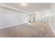 Large basement area with neutral carpeting at 10502 Washington Way, Northglenn, CO 80233