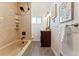 Clean bathroom with beige tile and modern fixtures at 10502 Washington Way, Northglenn, CO 80233