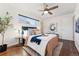 Well-lit bedroom with hardwood floors and a cozy atmosphere at 10502 Washington Way, Northglenn, CO 80233