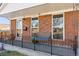 Inviting front porch with a bench, perfect for relaxing at 10502 Washington Way, Northglenn, CO 80233