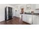 Sleek kitchen with stainless steel refrigerator and granite countertops at 10502 Washington Way, Northglenn, CO 80233