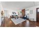 Bright living room with hardwood floors and a cozy seating area at 10502 Washington Way, Northglenn, CO 80233