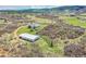 Panoramic aerial view of the property, showcasing the house, barn, and surrounding landscape at 3794 N State Highway 67, Sedalia, CO 80135