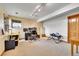 Large basement area with an office, workout equipment, and ample space at 3794 N State Highway 67, Sedalia, CO 80135