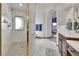 Spacious bathroom with elegant marble walk-in shower and white tile flooring at 3794 N State Highway 67, Sedalia, CO 80135