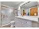 Bright bathroom with white vanity and a glass enclosed walk-in shower at 3794 N State Highway 67, Sedalia, CO 80135