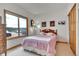 Cozy bedroom with bright window, plush carpeting, and charming decor at 3794 N State Highway 67, Sedalia, CO 80135