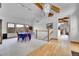 Open-concept dining area with vaulted ceilings, large windows, and elegant finishes at 3794 N State Highway 67, Sedalia, CO 80135