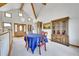 Elegant dining area features a vaulted ceiling, hardwood trim, and unique furnishings at 3794 N State Highway 67, Sedalia, CO 80135